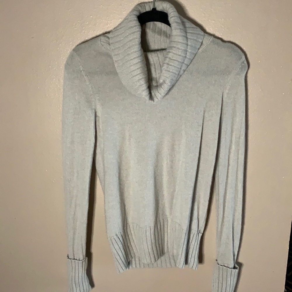 Grey cashmere cowl neck sweater.